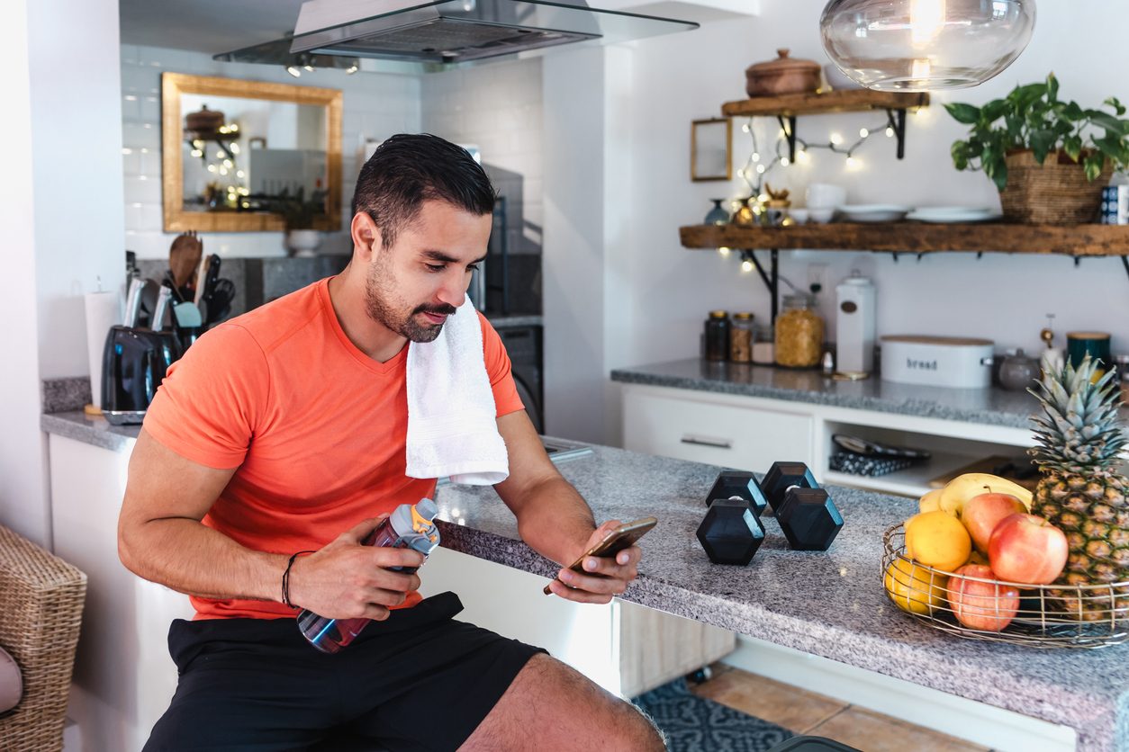 A young athlete putting a recovery meal together in the kitchen